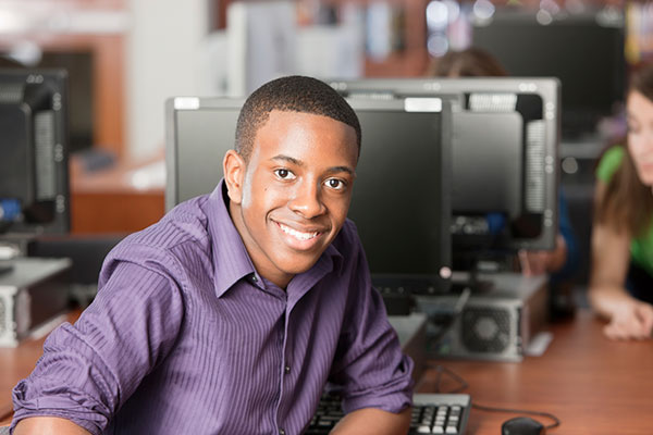 education-black-teenage-high-school-student-using-computer-in-library